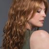 Woman turned away with red synthetic wig